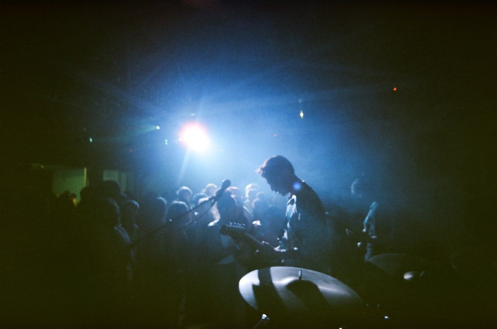 Band lit in blue stage light